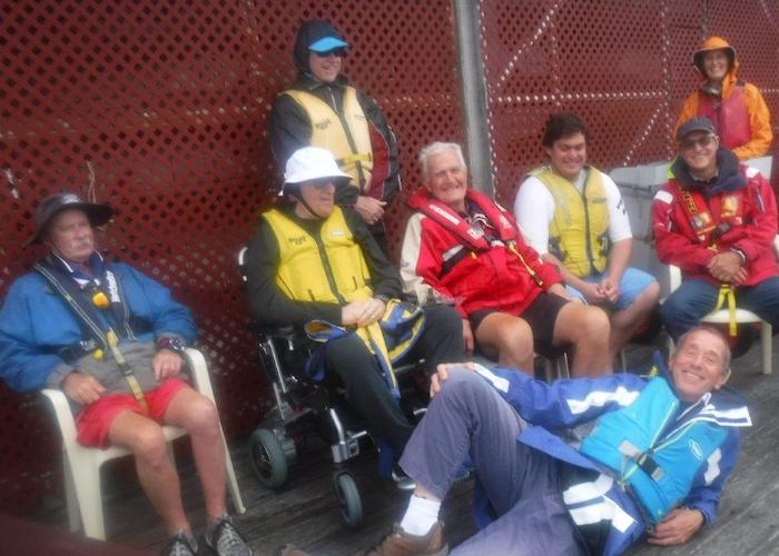 Volunteers and participants relaxing on the dock.